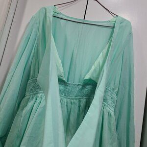 NWOT dress with straps to criss cross tie up, ruffle bottom